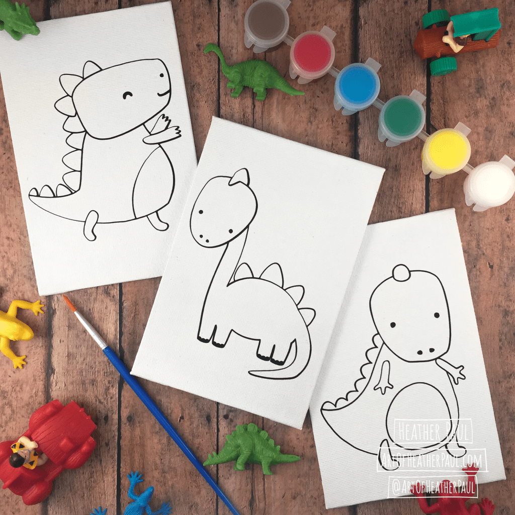 Image: Three small canvases featuring cute dinosaurs. Surrounding the canvases are various toys, a paint brush, and paint pods.